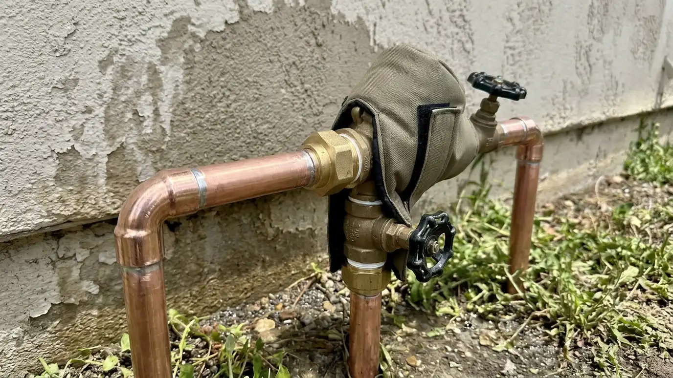 After: Leaking backflow device replaced | Music City Irrigation After: a backflow device with a new clean device with tidy pipes and an insulating cover